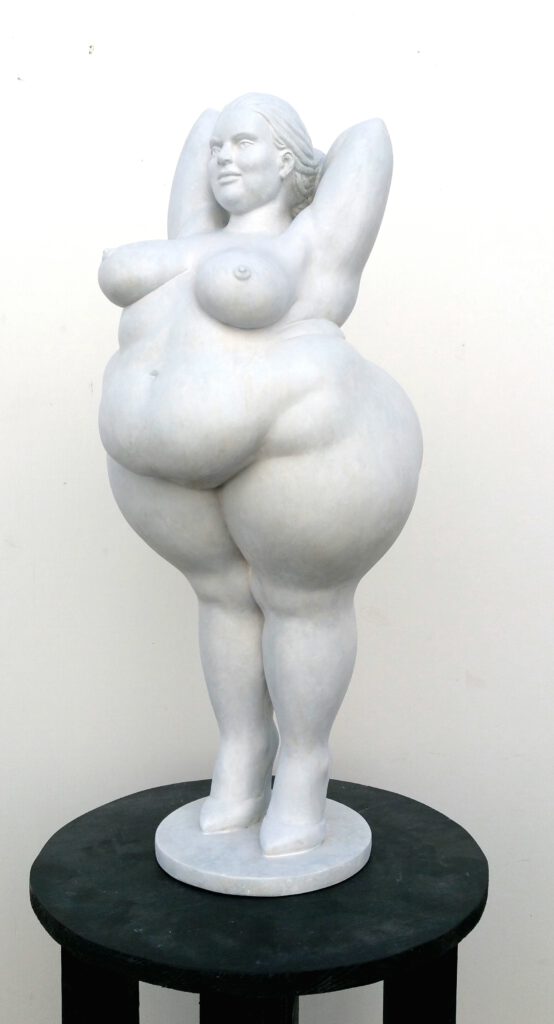 yolanda edition in 64cm height. Woman figure white a very voluptuous woman stands tall and with arms folded behind her head on high shoes.her posture is confident and inviting.a figurehead for all women who feel too fat, too loud or too different.