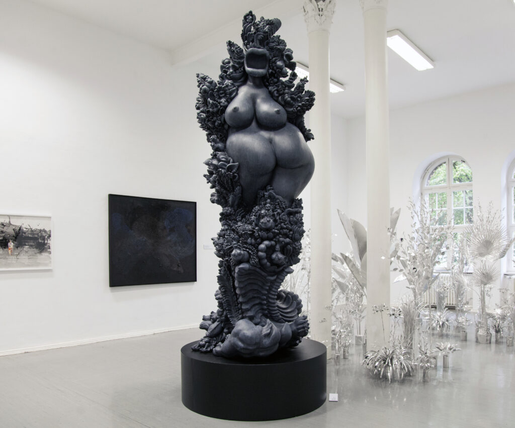 miriamlenk janusfee 2015. epoxy resin blue-grey patinated. abstracted, janus-headed torso of a woman in the midst of wildly wucgernder ornaments, plants and mixed creatures of woman and animal.exhibition chimera at the kunstquartier bethanien berlin 2019 .