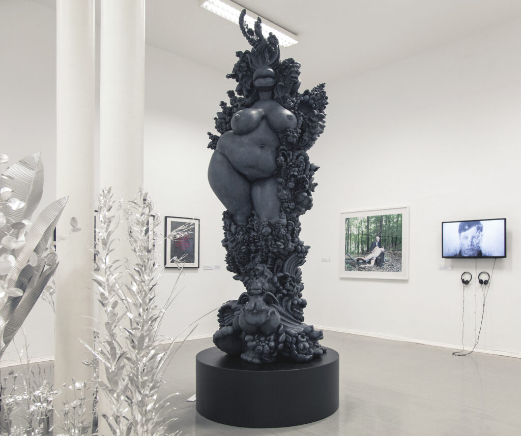 miriamlenk janusfee 2015. epoxy resin blue-grey patinated. abstract, janus-headed torso of a woman in the midst of wildly wucgernder ornaments, plants and mixed creatures of woman and animal.exhibition chimera at the kunstquartier bethanien berlin 2019 rear view